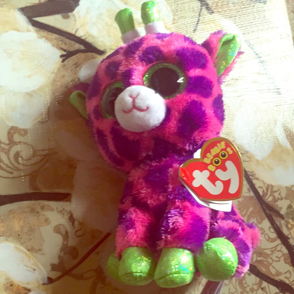 TY beanie baby with tag “Gilbert” reindeer